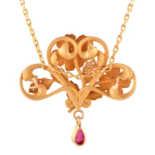 Modernist-style necklace with a floral pendant set with rub