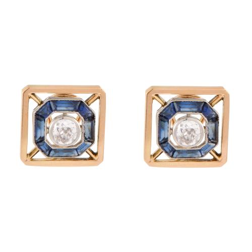 Pendientes estilo art déco con diamante central orlado de zafiros.
