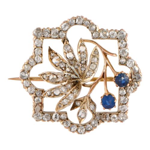 Broche noucentista en forma floral con diamantes y zafiros.